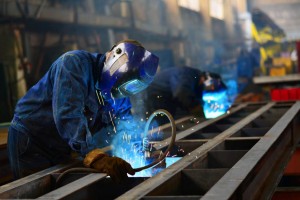 Welders at work in manufacturing