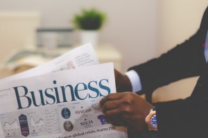 Businessman reading newspaper